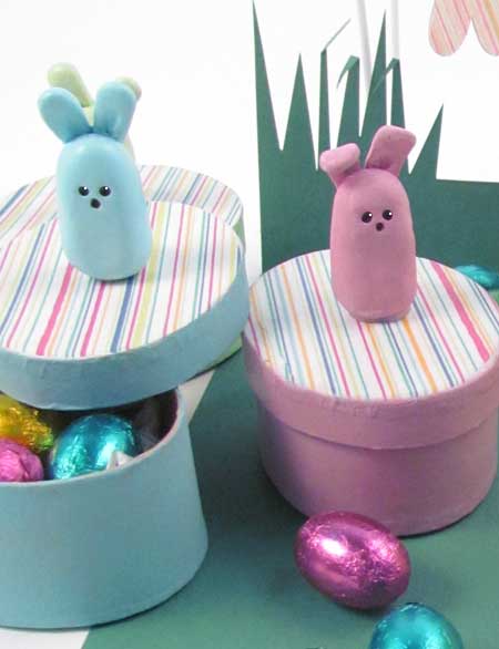 Bunny figures on top of the gift boxes 