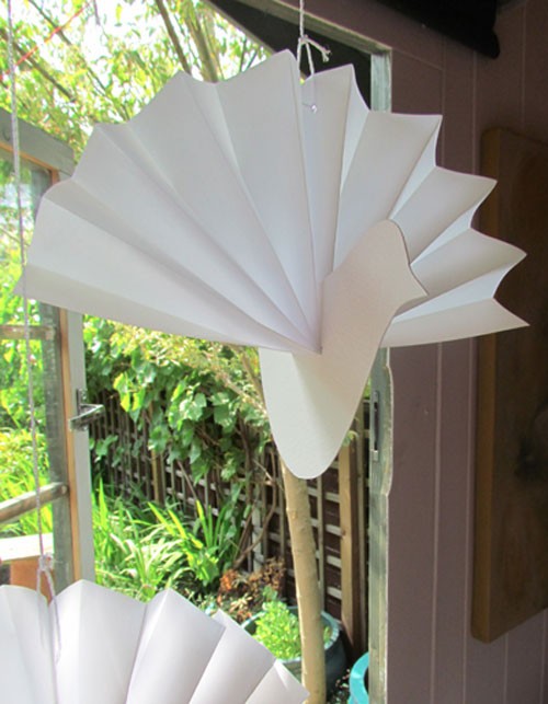 Concertina the paper to make the wings